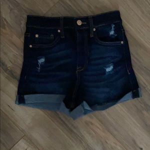 dark ripped blue jean shorts